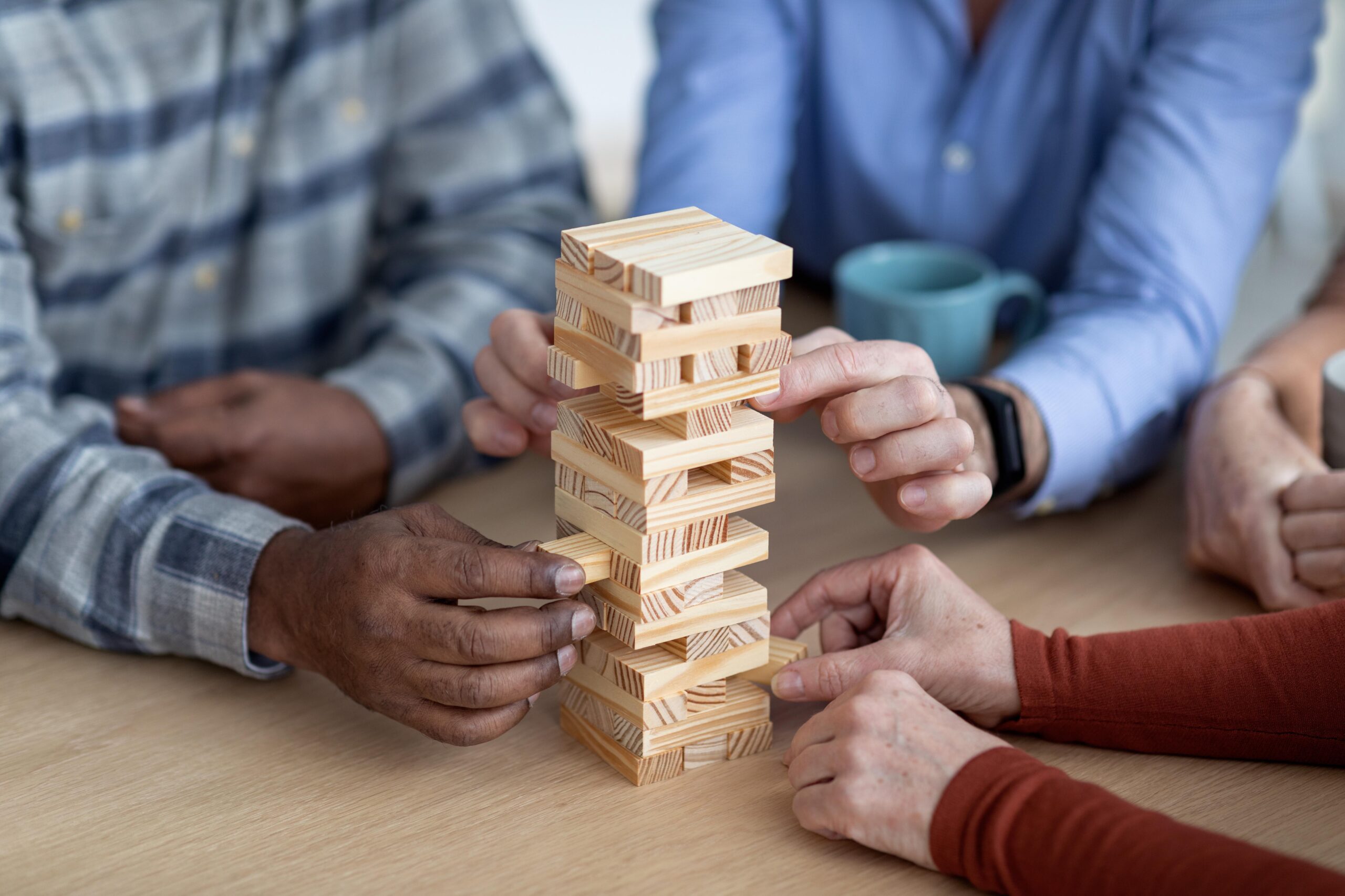 Group of people playing Jenga